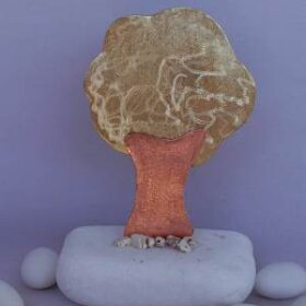 Μπομπονιέρα δέντρο ζωής με ματ φινίρισμα χάλκινος κορμός με μπρούτζο σε βότσαλο Θάσου