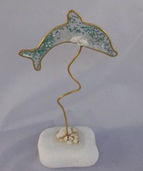 μπομπονιέρα δελφίνι με γκλίτερ χάντρες σε υγρό γυαλί και βότσαλο